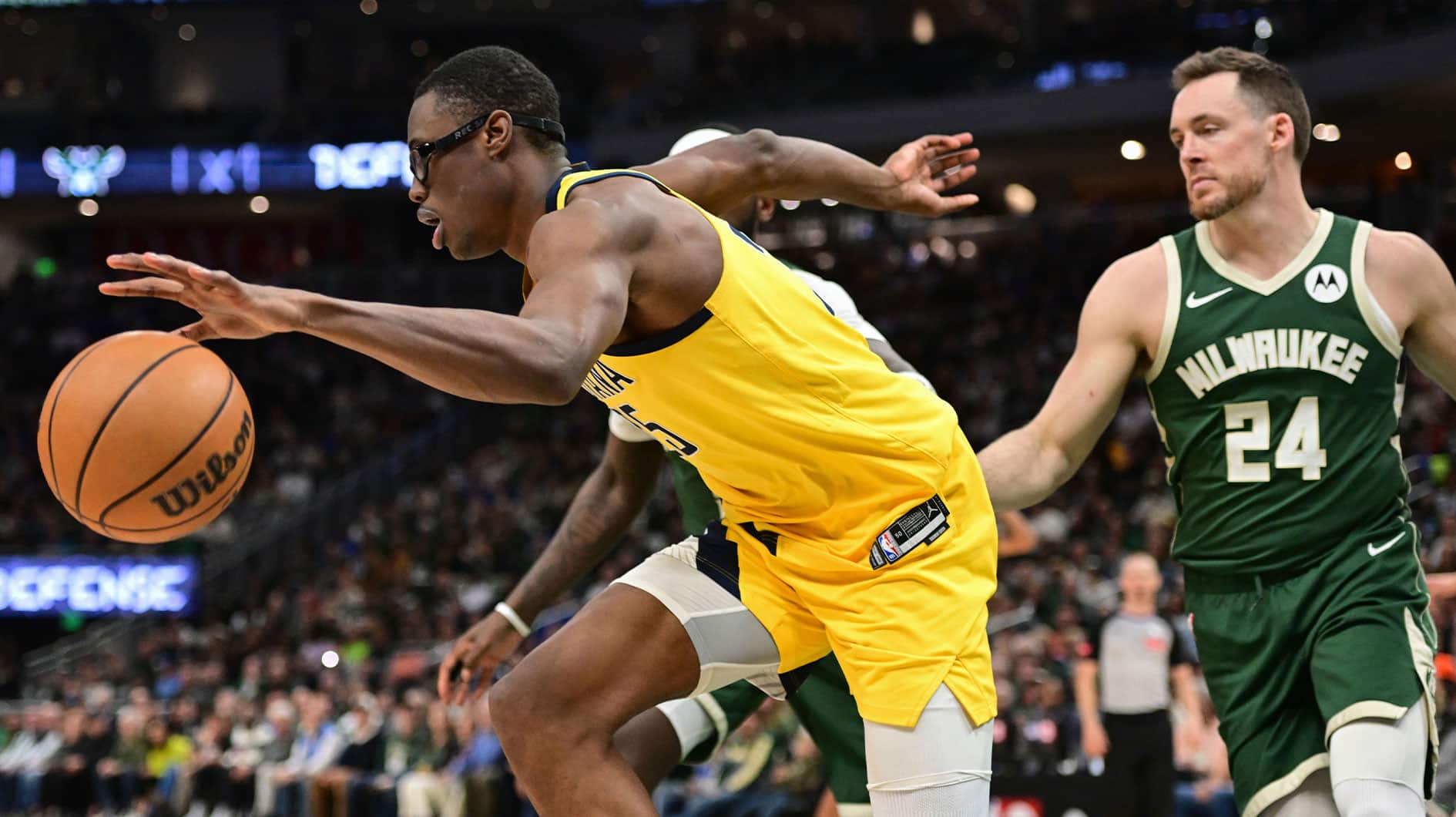 Indiana Pacers forward Jalen Smith (25) drives away from Milwaukee Bucks guard Pat Connaughton (24) in the in the third quarter during game one of the first round for the 2024 NBA playoffs at Fiserv Forum. 