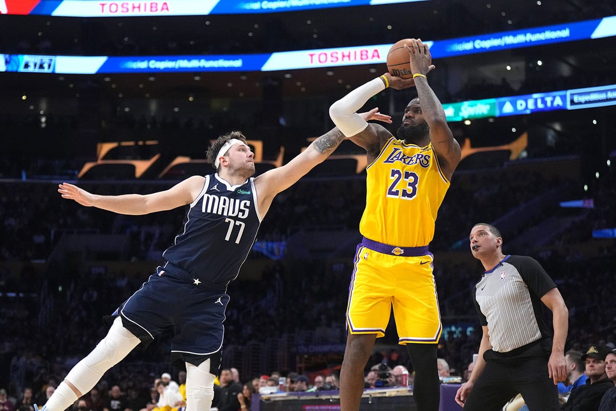  Los Angeles Lakers forward LeBron James (23) shoots the ball against Dallas Mavericks guard Luka Doncic (77) in the second half at Crypto.com Arena