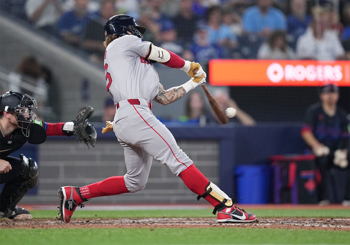 Boston Red Sox left fielder Jarren Duran (16) hits an RBI single against the Toronto Blue Jays during the sixth inning at Rogers Centre.