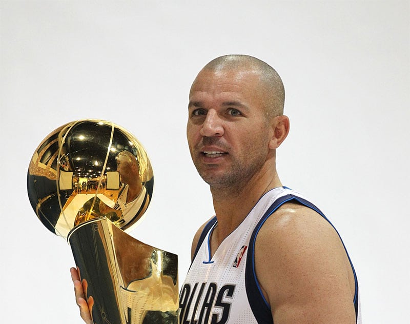 Dallas Mavericks guard Jason Kidd (2) poses for pictures with the Larry O'Brien NBA championship trophy during media day at American Airlines Center. 