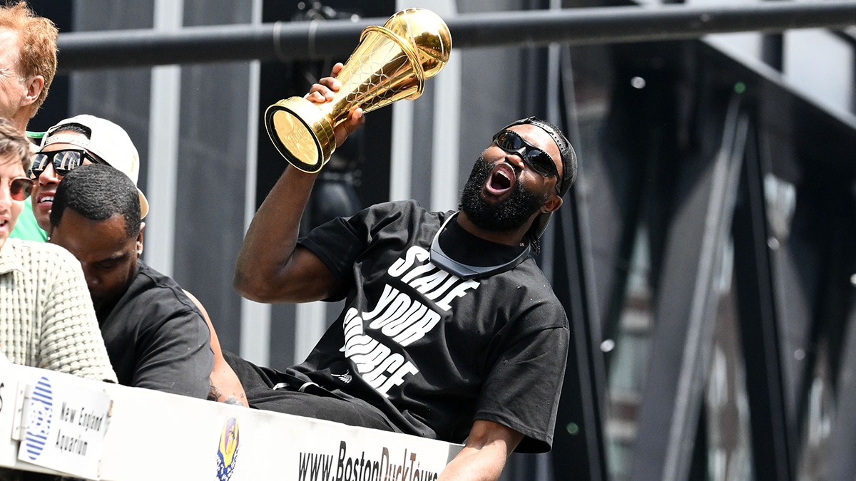 Boston Celtics guard Jaylen Brown (7) holds the MVP trophy during the 2024 NBA Championship parade in Boston