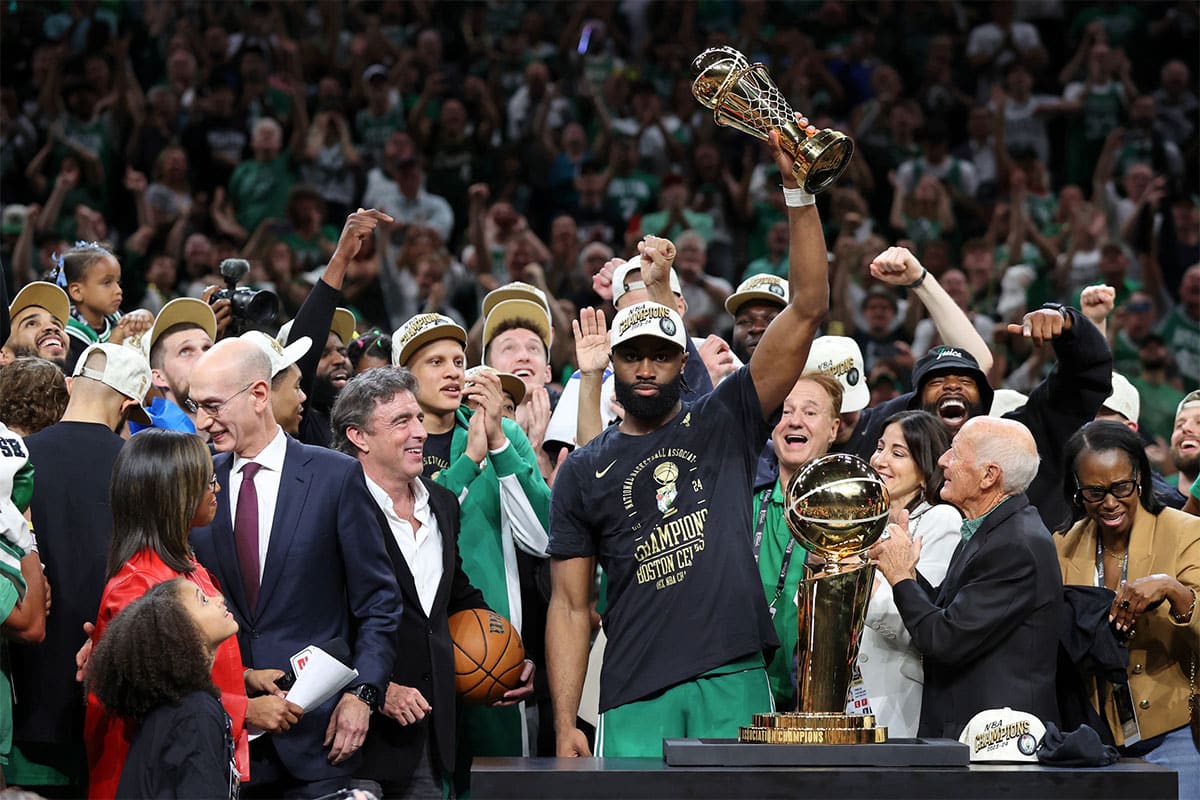 Boston Celtics guard Jaylen Brown (7) holds the MVP trophy after winning the 2024 NBA Finals against the Dallas Mavericks at TD Garden.