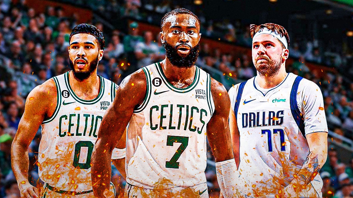 Photo: Jaylen Brown in action with fire around him in Celtics jersey, Jayson Tatum, Luka Doncic looking at him