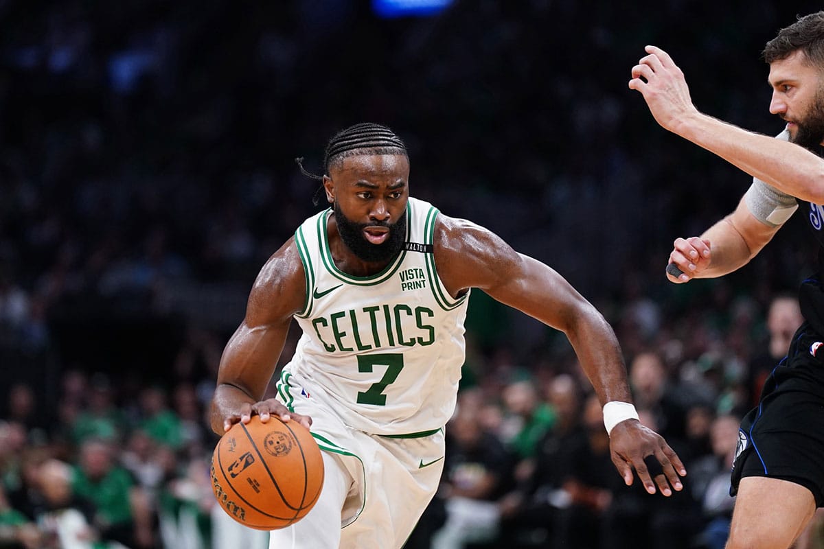 Boston Celtics guard Jaylen Brown (7) controls the ball against Dallas Mavericks forward Maxi Kleber (42) in the third quarter during game one of the 2024 NBA Finals at TD Garden.