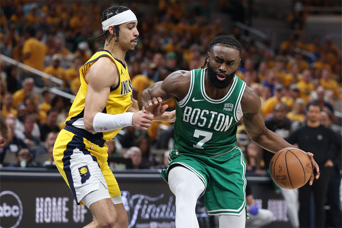 Boston Celtics guard Jaylen Brown (7) controls the ball against Indiana Pacers guard Andrew Nembhard (2) during the third quarter of game three of the eastern conference finals in the 2024 NBA playoffs at Gainbridge Fieldhouse.