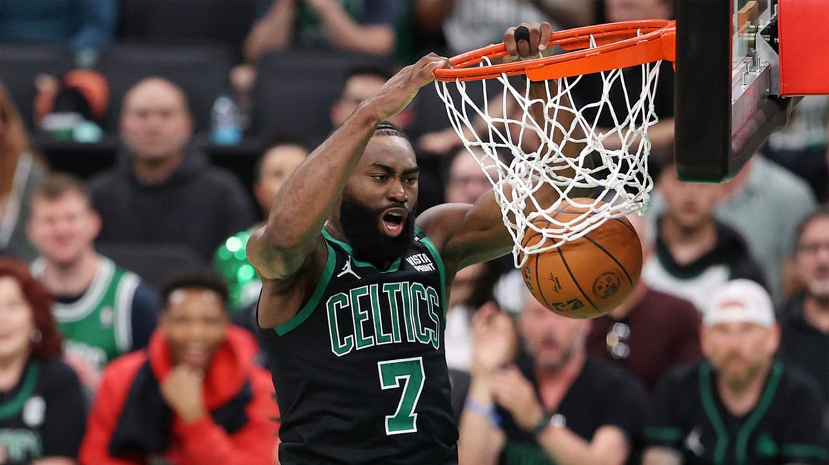  Boston Celtics guard Jaylen Brown (7) dunks against the Dallas Mavericks during the second quarter in game two of the 2024 NBA Finals at TD Garden. 