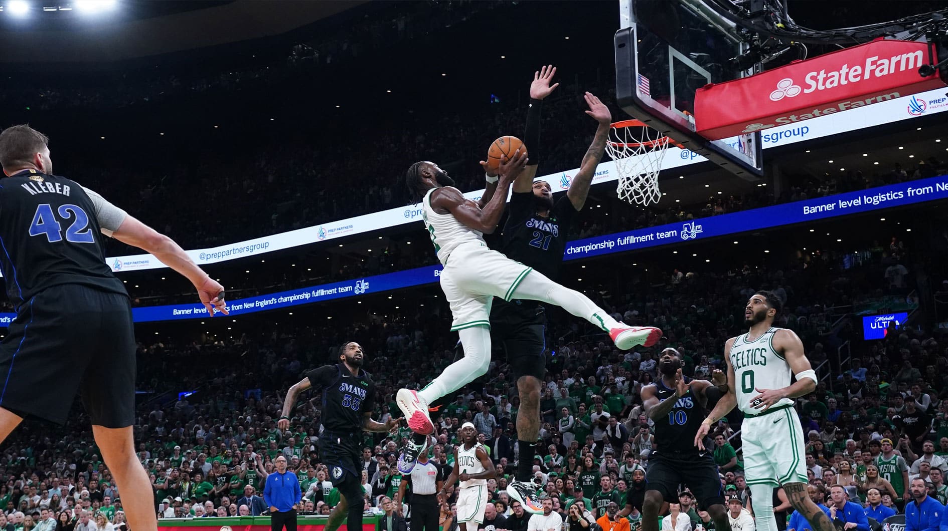 Boston Celtics guard Jaylen Brown (7) shoots against Dallas Mavericks center Daniel Gafford (21) in the third quarter during game one of the 2024 NBA Finals at TD Garden.