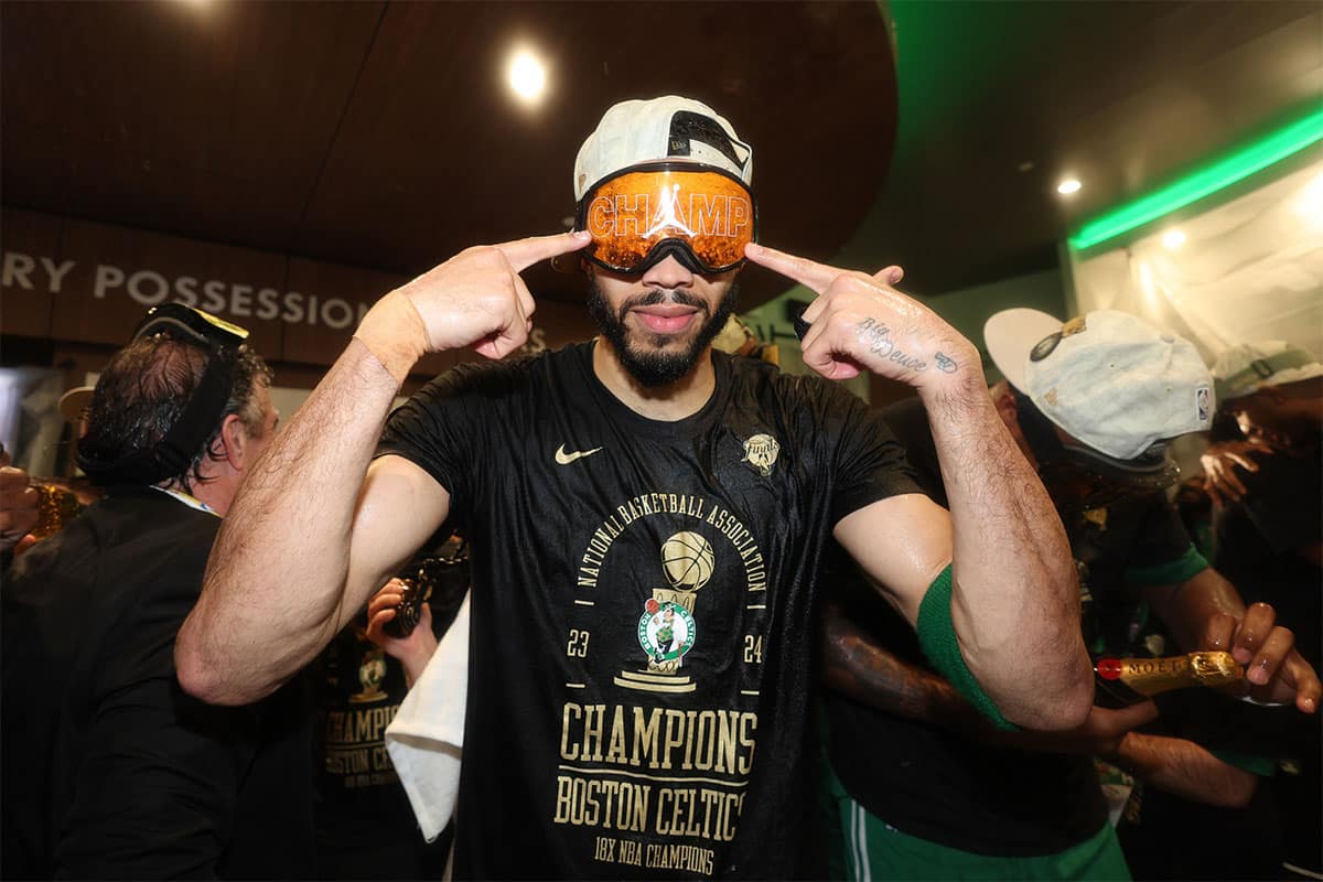  Boston Celtics forward Jayson Tatum (0) celebrates in the locker room after winning the 2024 NBA Finals against the Dallas Mavericks at TD Garden.