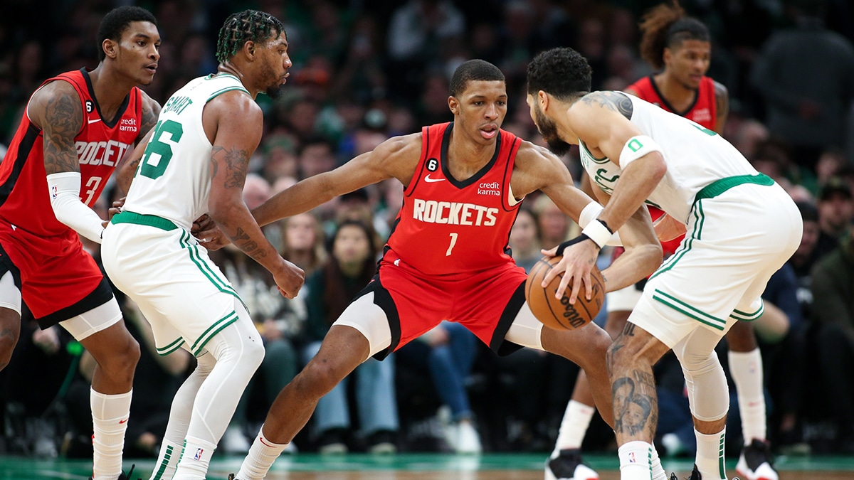 Boston Celtics forward Jayson Tatum (0) defended by Houston Rockets forward Jabari Smith (1) during the first half at TD Garden. 