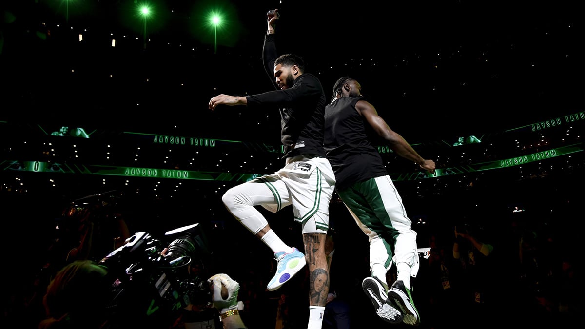 Boston Celtics forward Jayson Tatum (0) and guard Jaylen Brown (7) react after being introduced before game one of the first round for the 2024 NBA playoffs against the Miami Heat at TD Garden