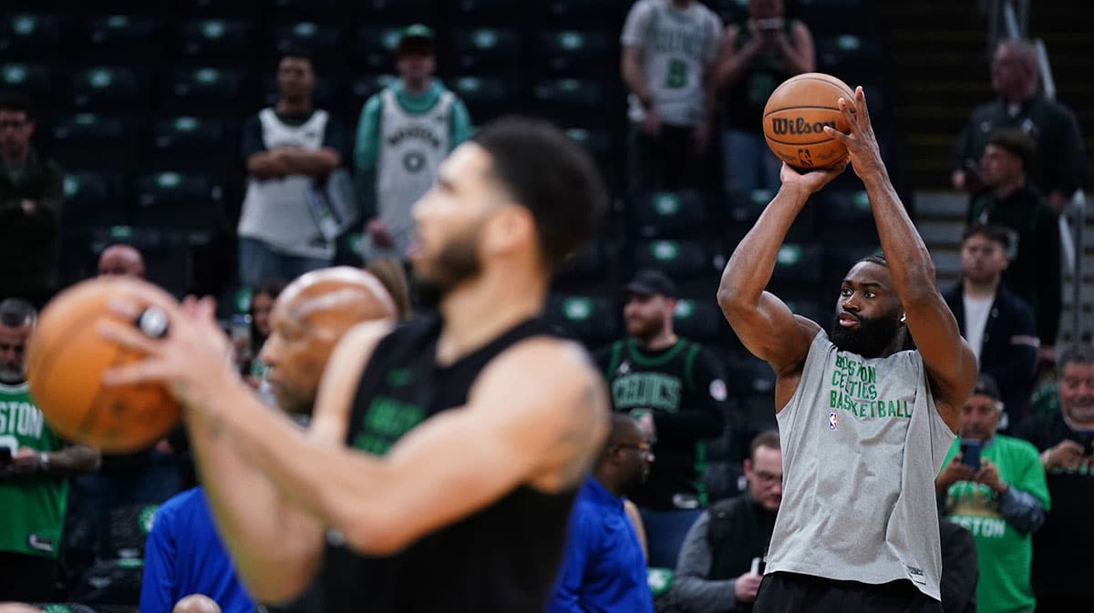 Boston Celtics guard Jaylen Brown (7) and forward Jayson Tatum (0) warm up before game five of the second round for the 2024 NBA playoffs against the Cleveland Cavaliers at TD Garden. 