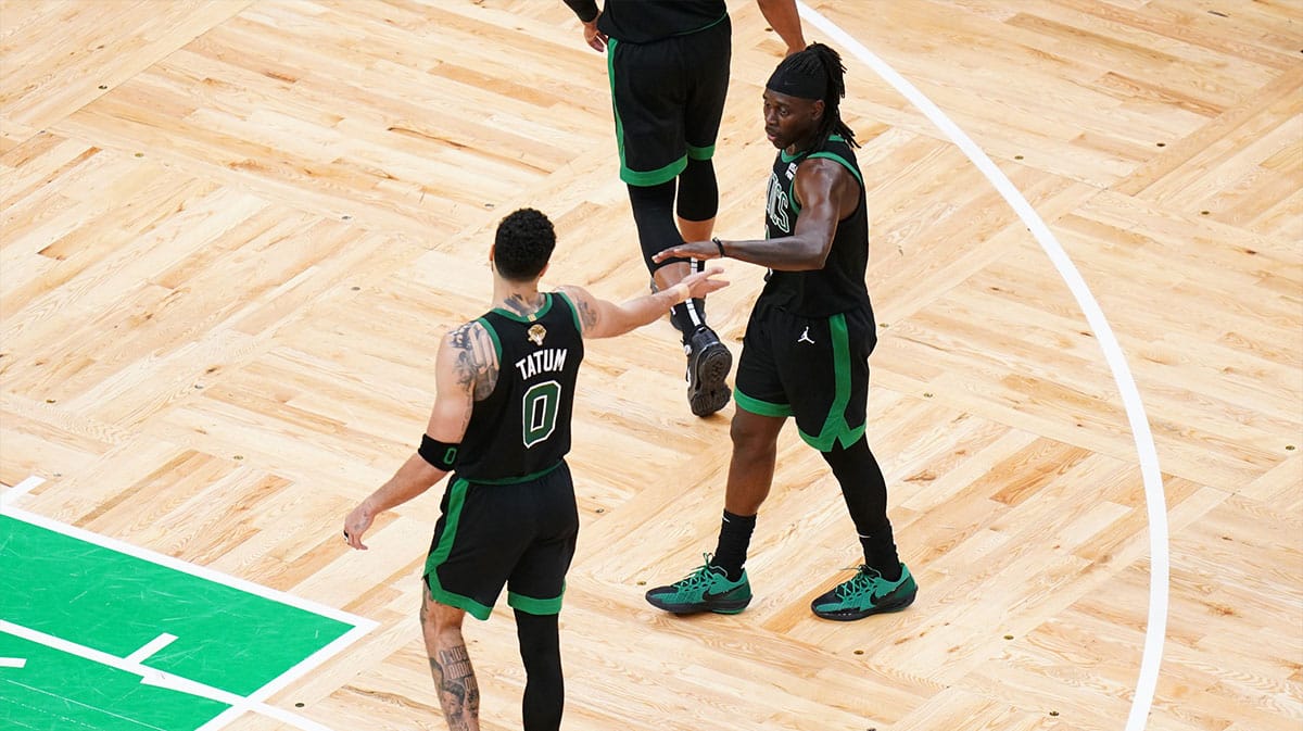 Boston Celtics forward Jayson Tatum (0) and guard Jrue Holiday (4) celebrate after game two against the Dallas Mavericks in the 2024 NBA Finals at TD Garden.