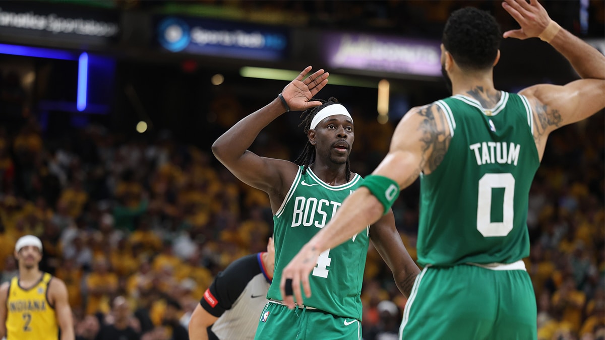 Boston Celtics guard Jrue Holiday (4) celebrates with forward Jayson Tatum (0) after drawing a foul against the Indiana Pacers in the closing seconds of the fourth quarter of game three of the eastern conference finals in the 2024 NBA playoffs at Gainbridge Fieldhouse