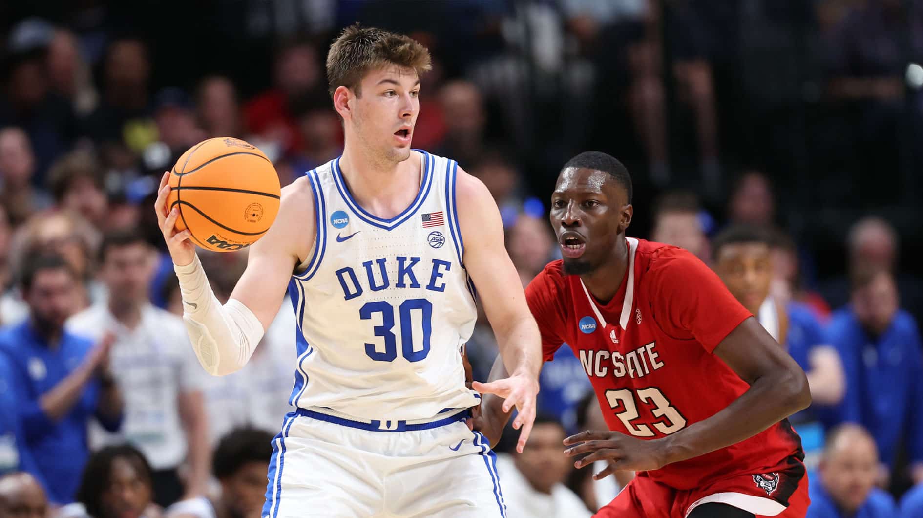 Duke Blue Devils center Kyle Filipowski (30) controls the ball against North Carolina State Wolfpack forward Mohamed Diarra (23) in the second half in the finals of the South Regional of the 2024 NCAA Tournament at American Airline Center. 