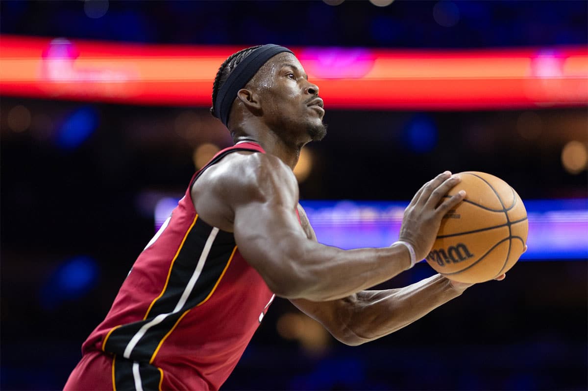 Miami Heat forward Jimmy Butler (22) lines up a shot against the Philadelphia 76ers during the second quarter of a play-in game of the 2024 NBA playoffs at Wells Fargo Center. 