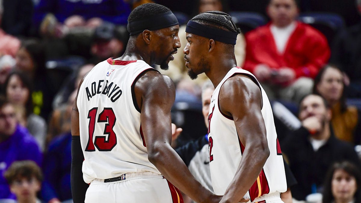 Miami Heat forward Jimmy Butler (22) and center/forward Bam Adebayo (13) talk before a free-throw shot against the Utah Jazz during the second half at Vivint Arena.