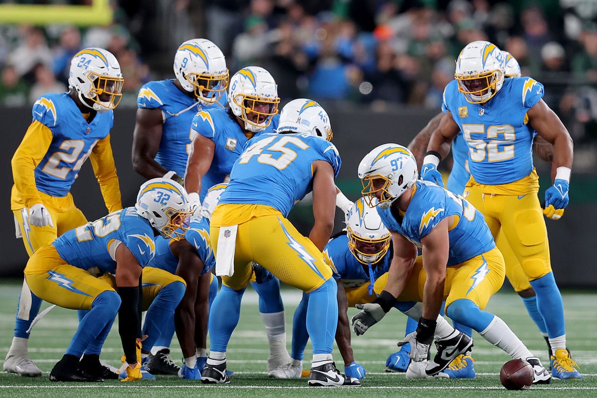 Los Angeles Chargers linebacker Joey Bosa (97) celebrates with teammates after recovering a New York Jets fumble during the first quarter at MetLife Stadium.