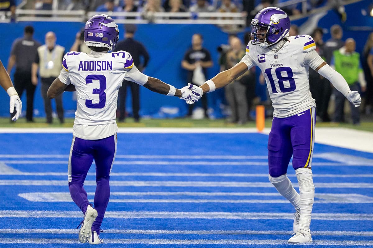 Minnesota Vikings wide receiver Jordan Addison (3) catches a pass for a touchdown and celebrates with wide receiver Justin Jefferson (18) during second half of the game against the Detroit Lions at Ford Field.