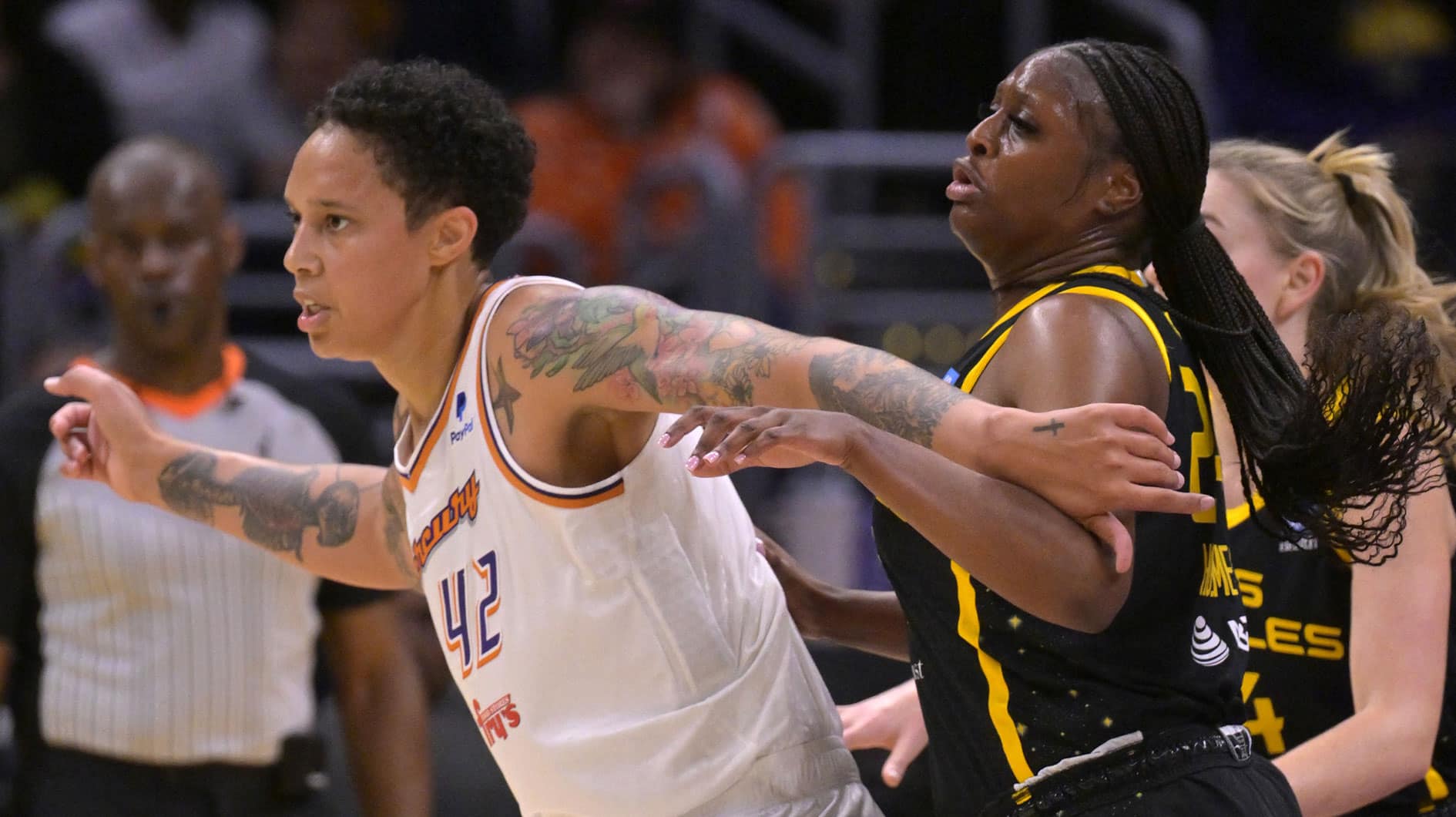 Phoenix Mercury center Brittney Griner (42) is defended by Los Angeles Sparks forward Joyner Holmes (24) in the first half.