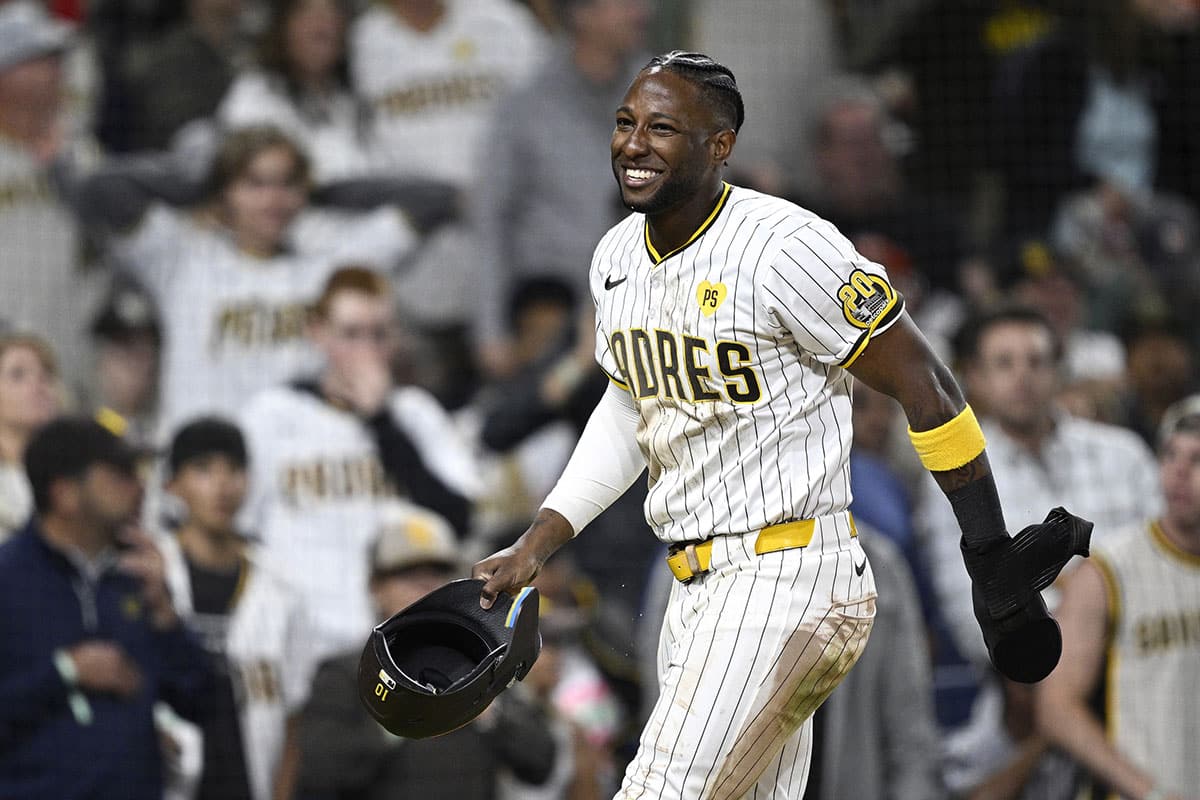 San Diego Padres left fielder Jurickson Profar (10) smiles after being tagged out at home during the fifth inning against the Oakland Athletics at Petco Park.