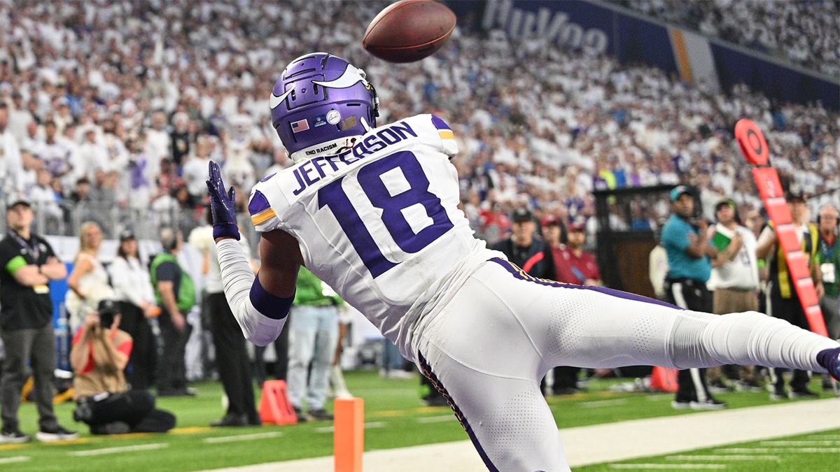 Minnesota Vikings wide receiver Justin Jefferson (18) catches a touchdown pass from quarterback Nick Mullens (not pictured) as Detroit Lions cornerback Cameron Sutton (1) defends during the second quarter at U.S. Bank Stadium.