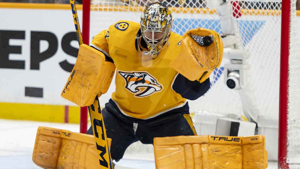 Nashville Predators goaltender Juuse Saros (74) makes a glove save against the Vancouver Canucks during the second period in game six of the first round of the 2024 Stanley Cup Playoffs at Bridgestone Arena.