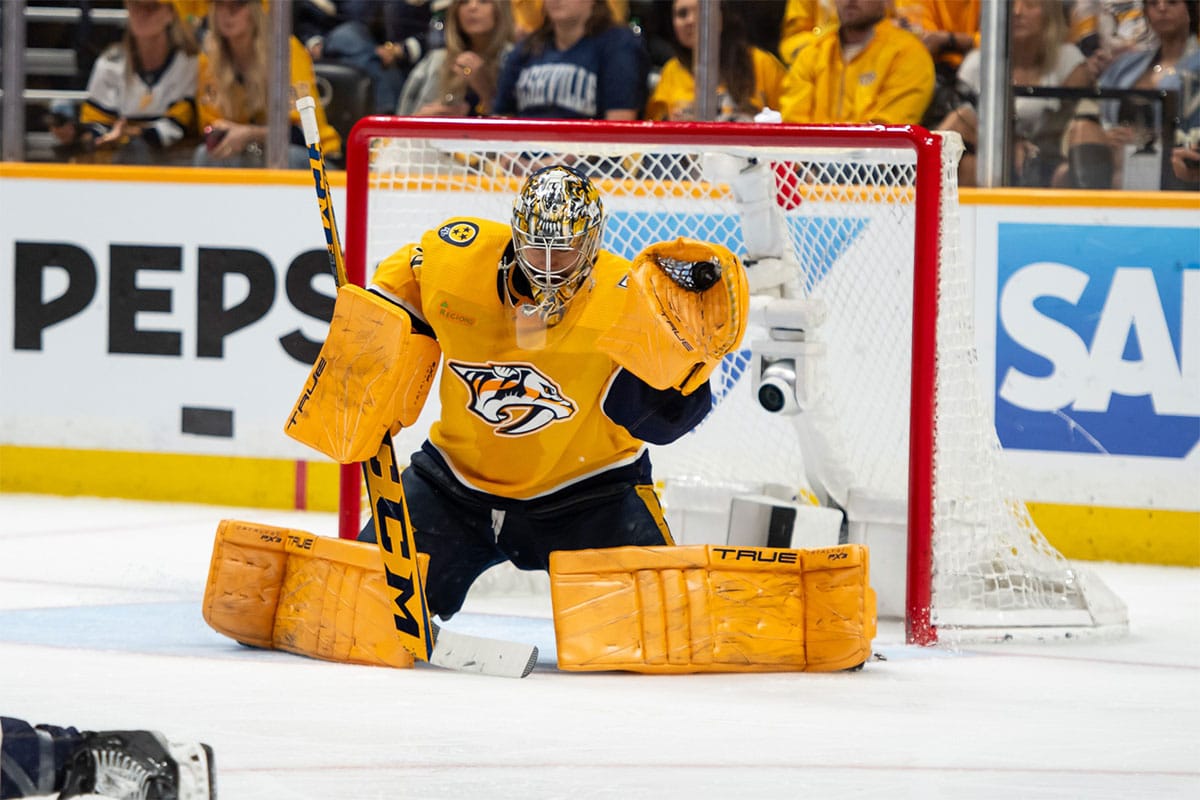 Nashville Predators goaltender Juuse Saros (74) makes a glove save against the Vancouver Canucks during the second period in game six of the first round of the 2024 Stanley Cup Playoffs at Bridgestone Arena.