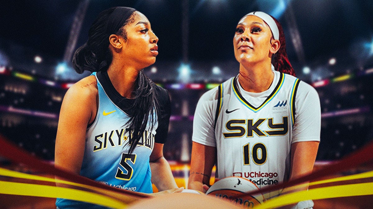 Sky's Kamilla Cardoso stands next to Angel Reese during Fever game