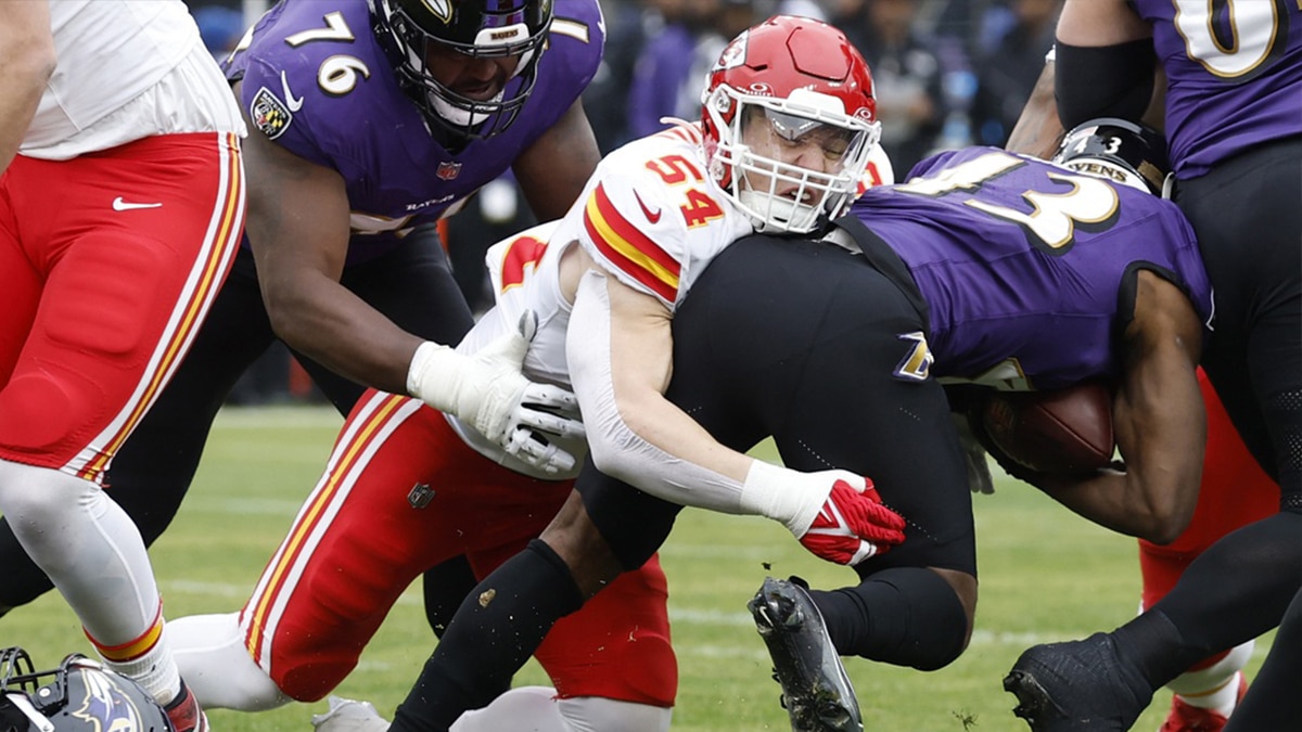 Kansas City Chiefs linebacker Leo Chenal (54) tackles Baltimore Ravens running back Justice Hill (43) in the AFC Championship football game at M&T Bank Stadium. 