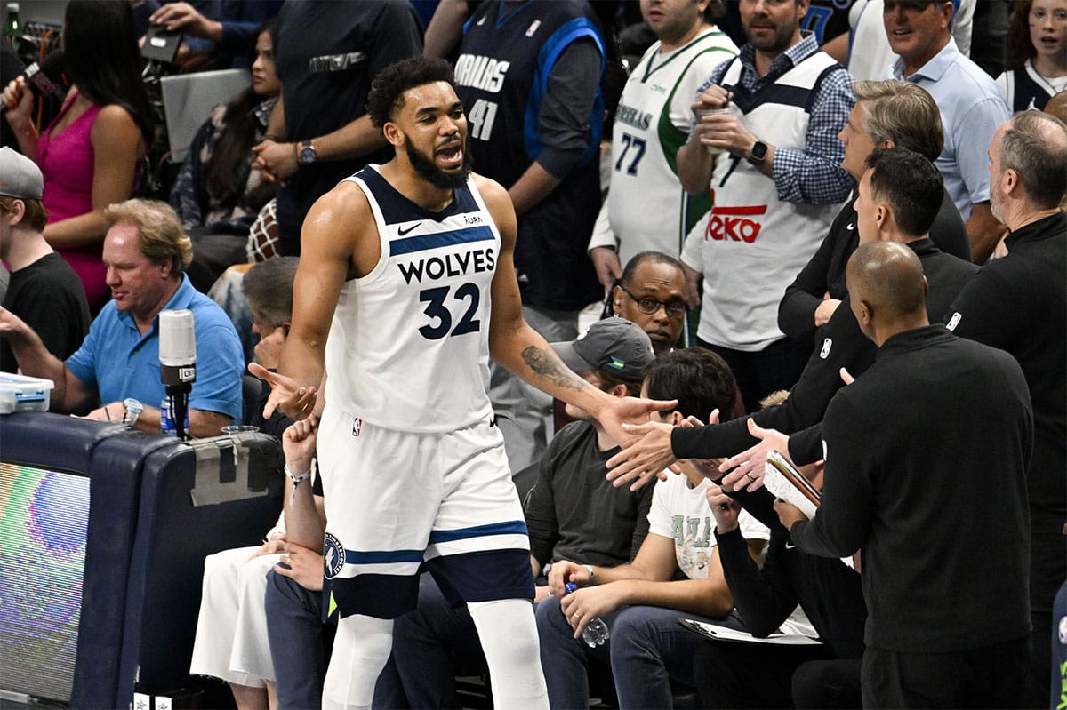 Minnesota Timberwolves center Karl-Anthony Towns (32) fouls out against the Dallas Mavericks during the second half in game four of the western conference finals for the 2024 NBA playoffs at American Airlines Center.