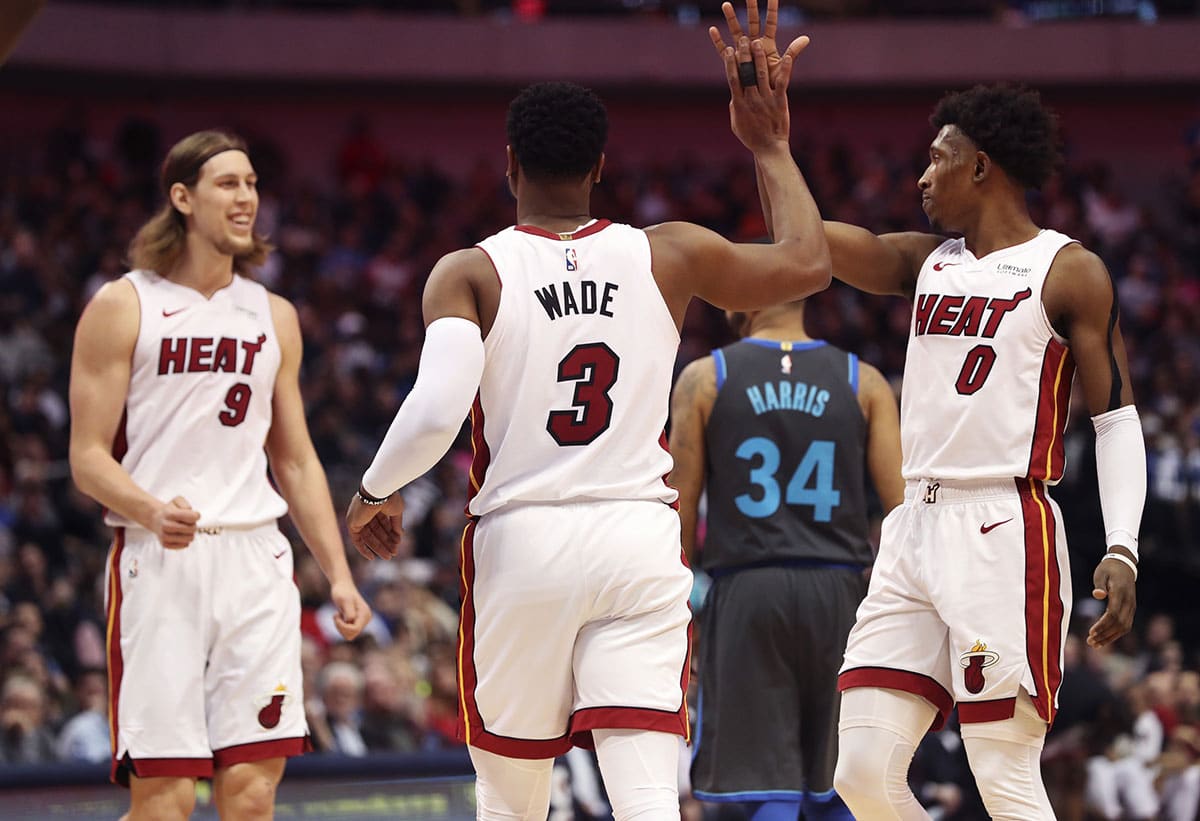 Miami Heat players Kelly Olynyk, Dwyane Wade, and Josh Richardson