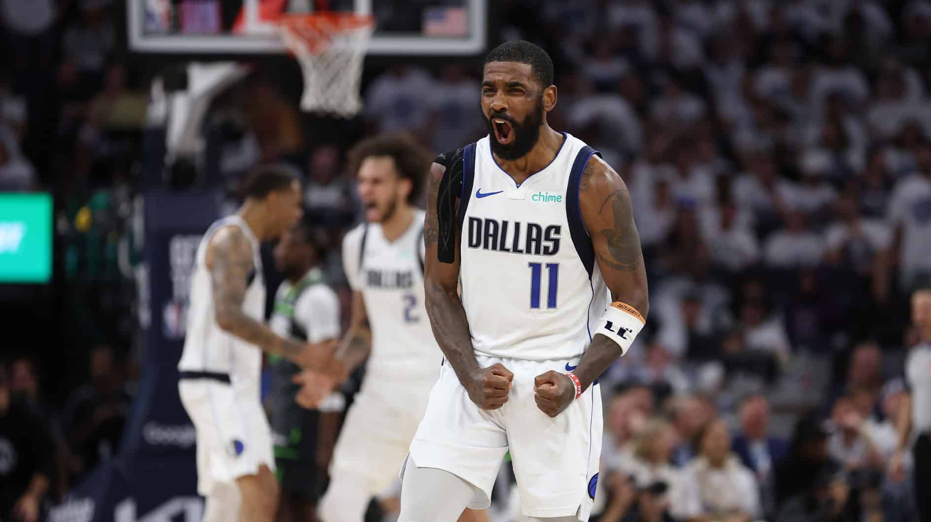 Dallas Mavericks guard Kyrie Irving (11) celebrates during the fourth quarter against the Minnesota Timberwolves in game five of the western conference finals for the 2024 NBA playoffs at Target Center.