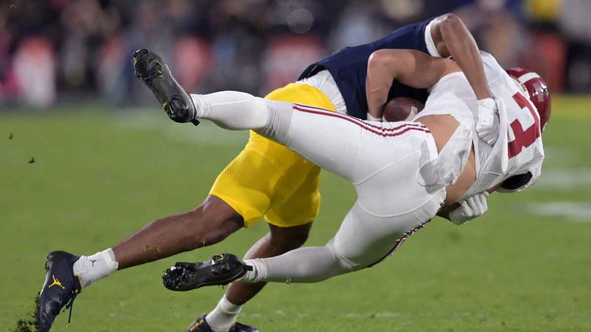 Alabama Crimson Tide wide receiver Jermaine Burton (3) is tackled by Michigan Wolverines defensive back Keon Sabb (3) during the second half in the 2024 Rose Bowl college football playoff semifinal game at Rose Bowl.
