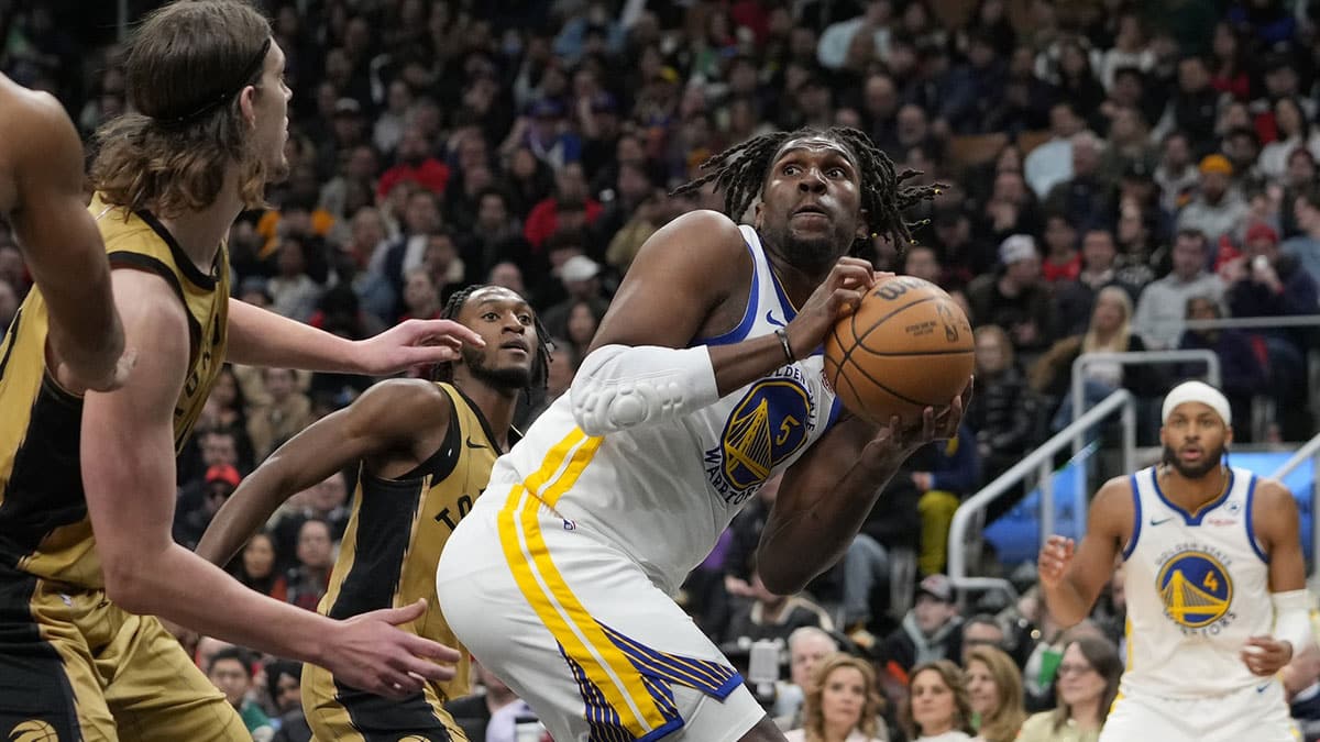 Golden State Warriors forward Kevon Looney (5) looks to make a play against the Toronto Raptors during the second half at Scotiabank Arena.