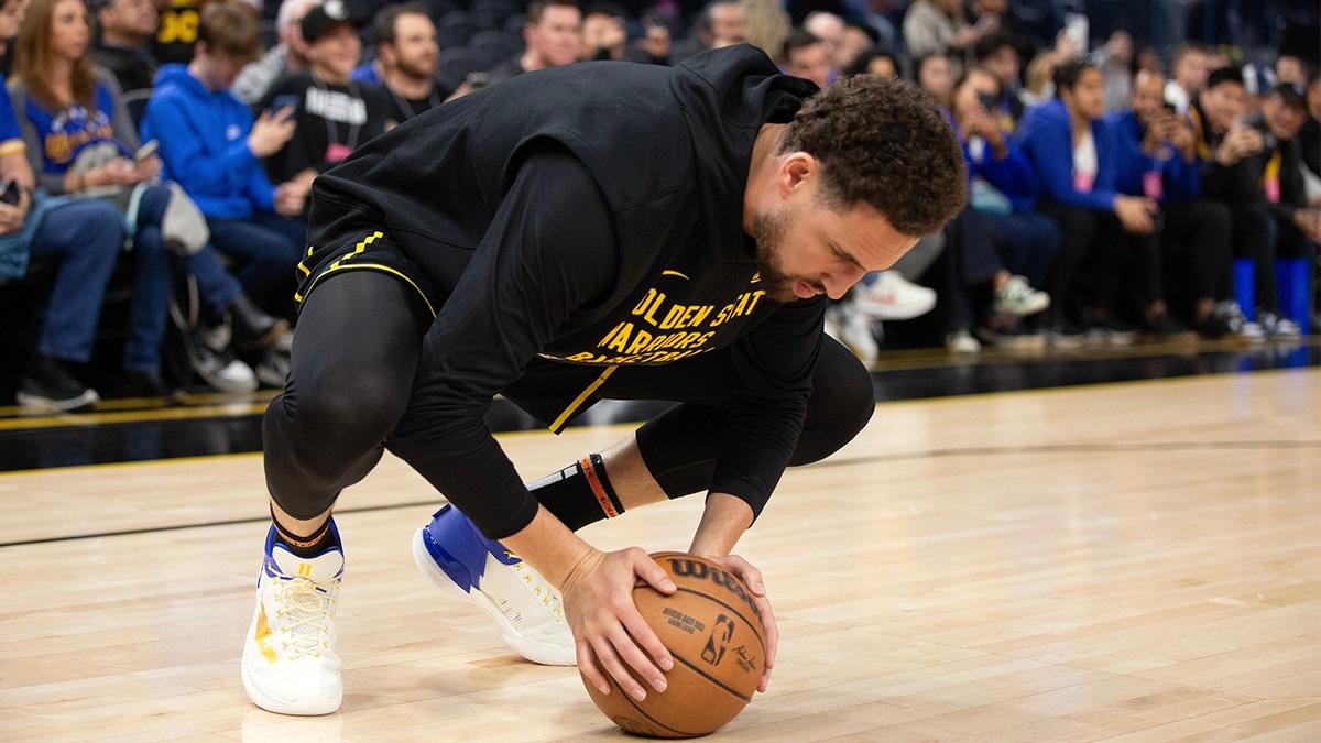Golden State Warriors guard Klay Thompson stretches before taking on the Memphis Grizzlies Chase Center.