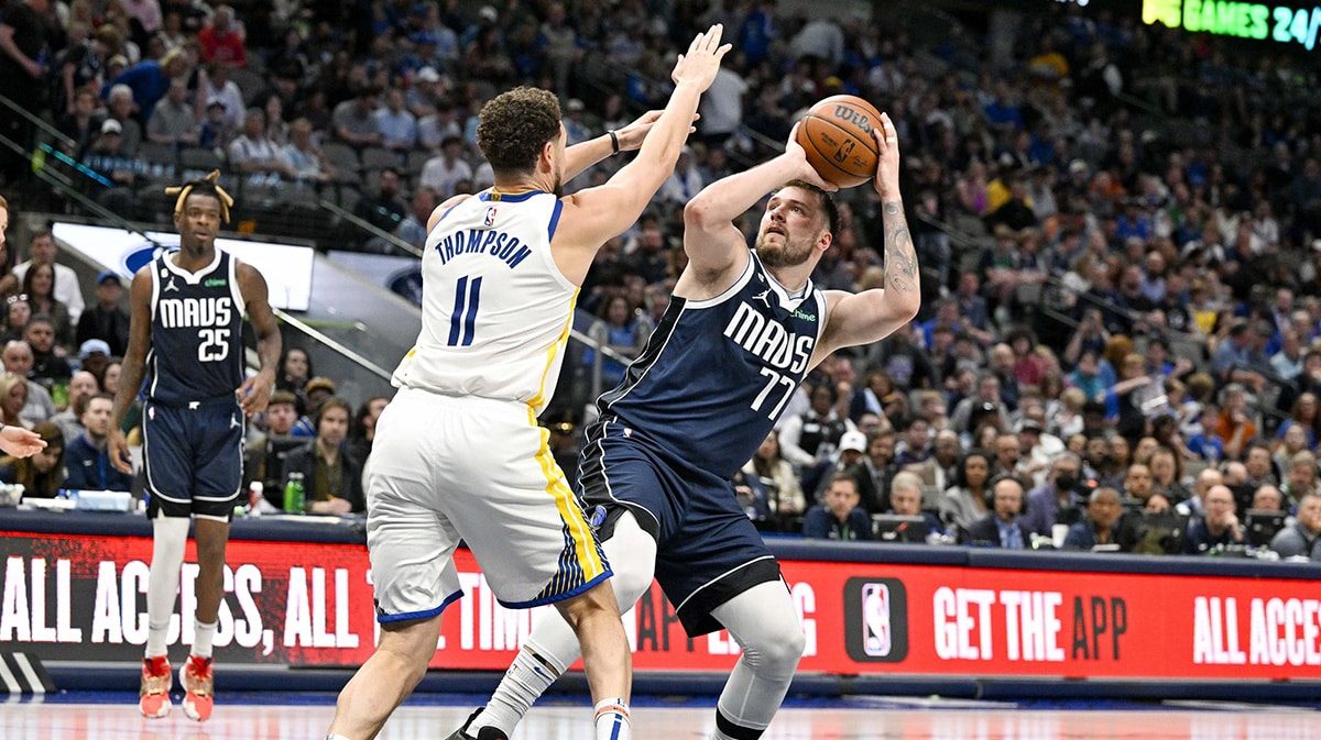 Golden State Warriors guard Klay Thompson (11) and Dallas Mavericks guard Luka Doncic (77) in action during the game between the Dallas Mavericks and the Golden State Warriors at the American Airlines Center.