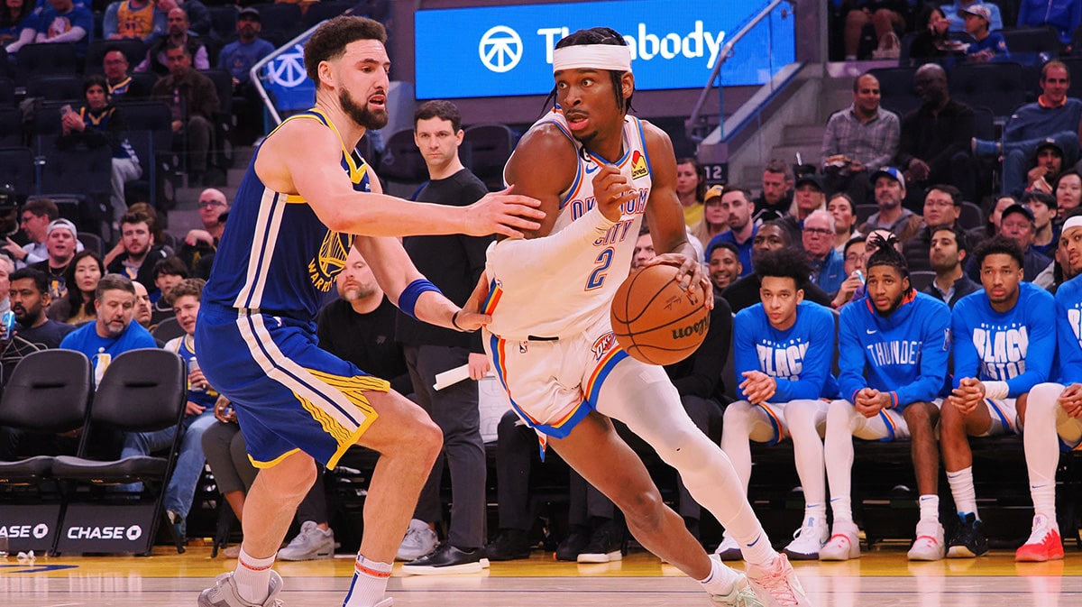 Oklahoma City Thunder shooting guard Shai Gilgeous-Alexander (2) controls the ball against Golden State Warriors shooting guard Klay Thompson (11) during the third quarter at Chase Center.