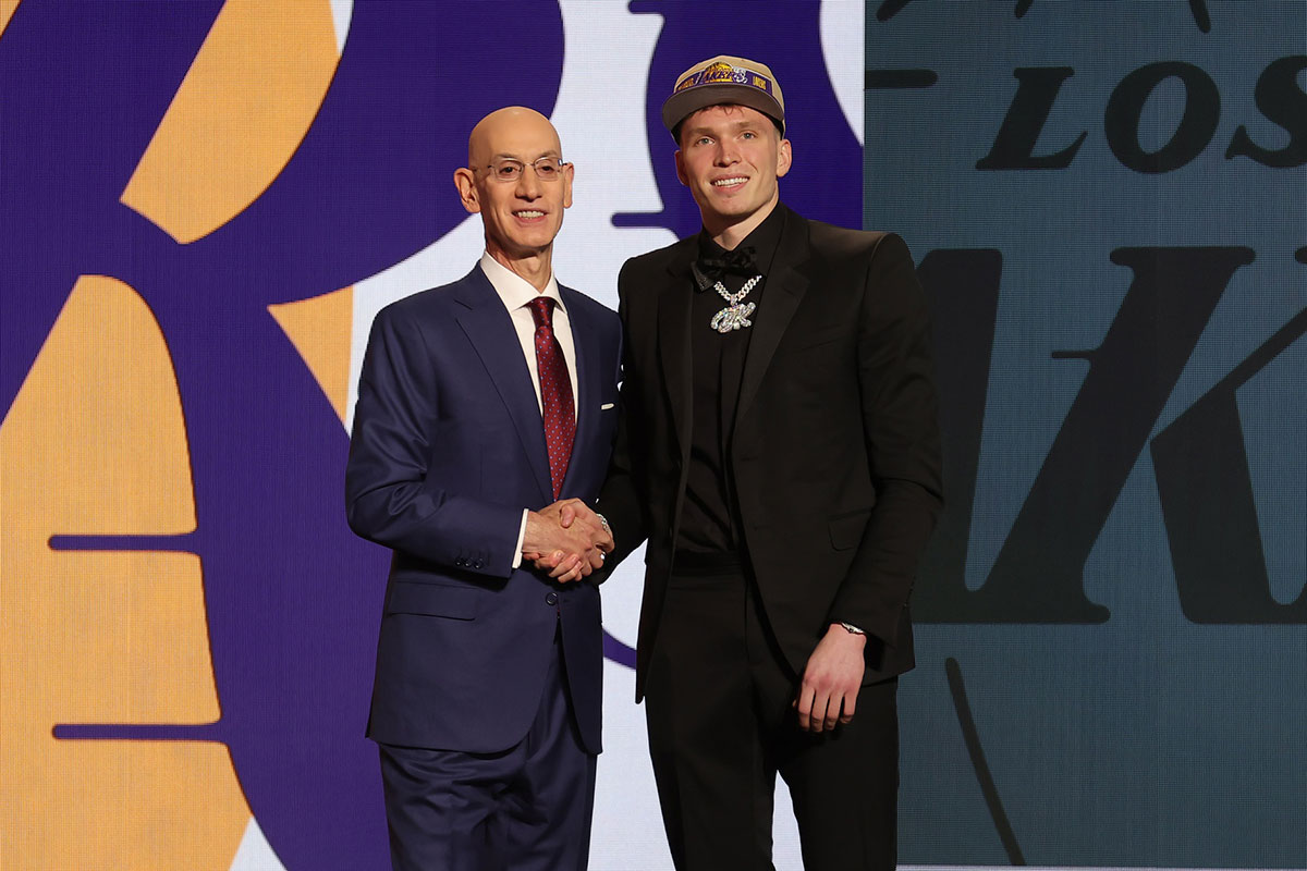 Dalton Knecht poses for photos with NBA commissioner Adam Silver after being selected in the first round by the Los Angeles Lakers in the 2024 NBA Draft at Barclays Center.