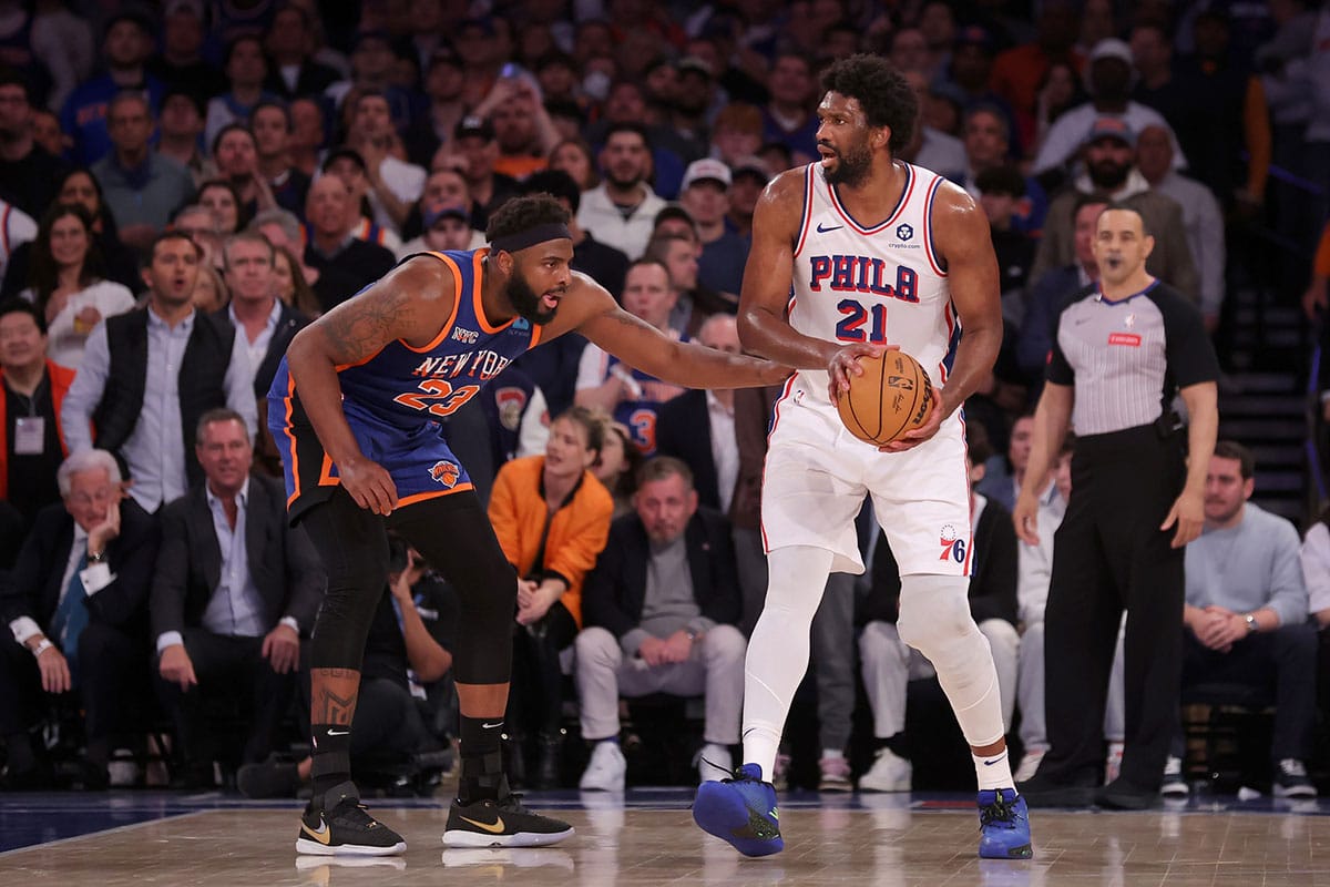 Philadelphia 76ers center Joel Embiid (21) controls the ball against New York Knicks center Mitchell Robinson (23) during the fourth quarter of game 5 of the first round of the 2024 NBA playoffs at Madison Square Garden.