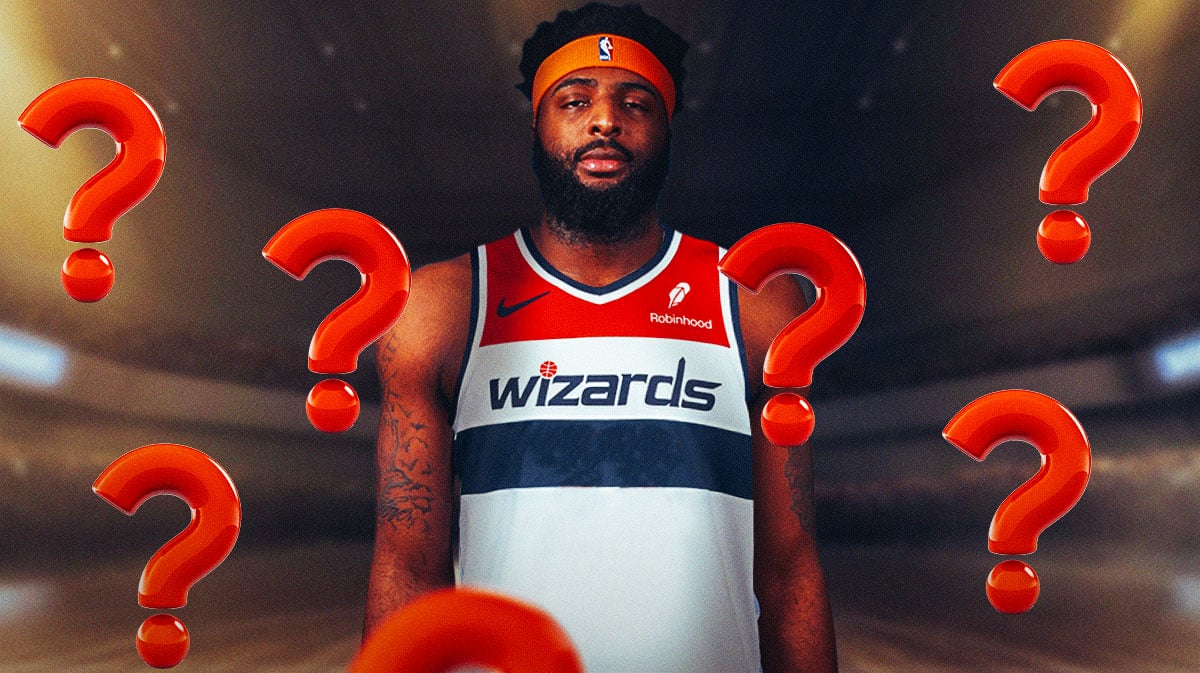 Mitchell Robinson in a Wizards uniform. Question marks around him.