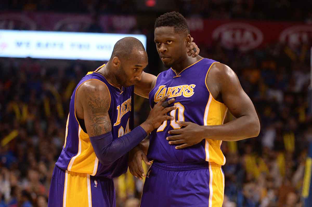 Los Angeles Lakers forward Kobe Bryant (24) speaks to Los Angeles Lakers forward Julius Randle (30) during action against the Oklahoma City Thunder during the third quarter at Chesapeake Energy Arena. 