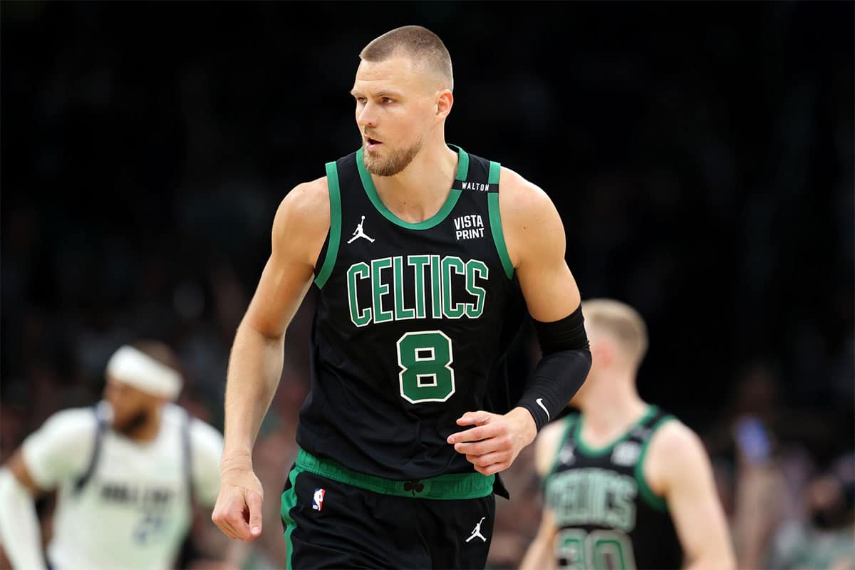 Boston Celtics center Kristaps Porzingis (8) reacts after a play against the Dallas Mavericks during the first quarter in game two of the 2024 NBA Finals at TD Garden. 