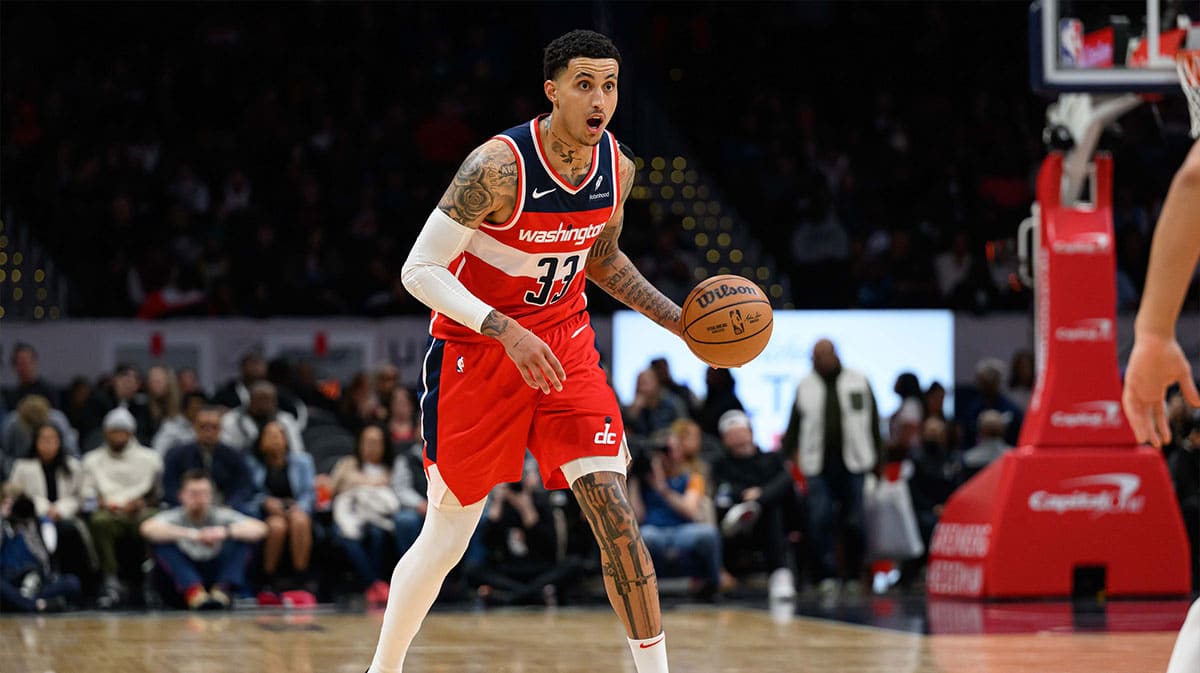 Washington Wizards forward Kyle Kuzma (33) brings the ball up court against the Detroit Pistons during the second quarter at Capital One Arena.