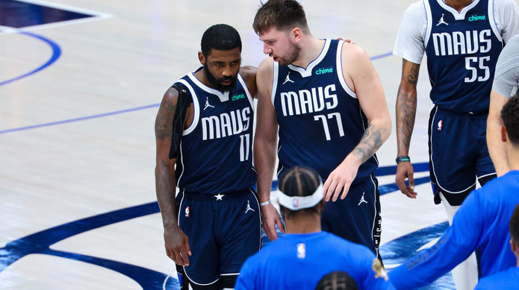 Dallas Mavericks guard Kyrie Irving (11) reacts with Dallas Mavericks guard Luka Doncic (77) during the second half against the Boston Celtics during game four of the 2024 NBA Finals at American Airlines Center.