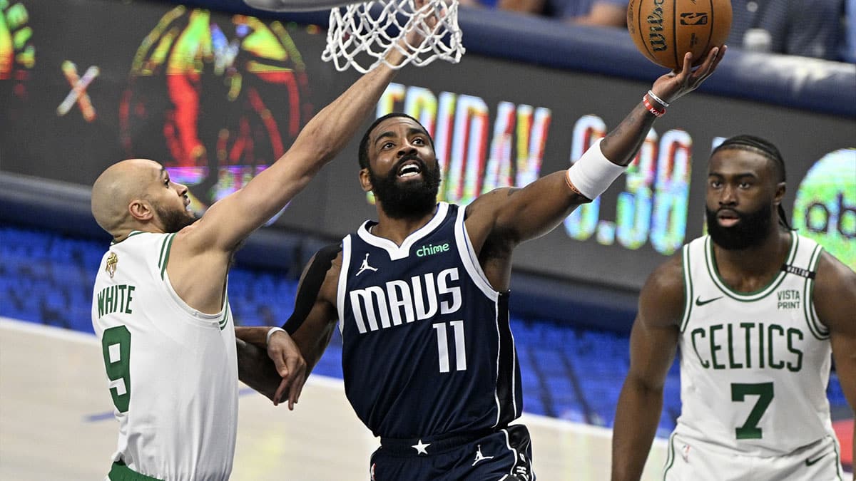 Dallas Mavericks guard Kyrie Irving (11) shoots against Boston Celtics guard Derrick White (9) during the third quarter in game three of the 2024 NBA Finals at American Airlines Center.