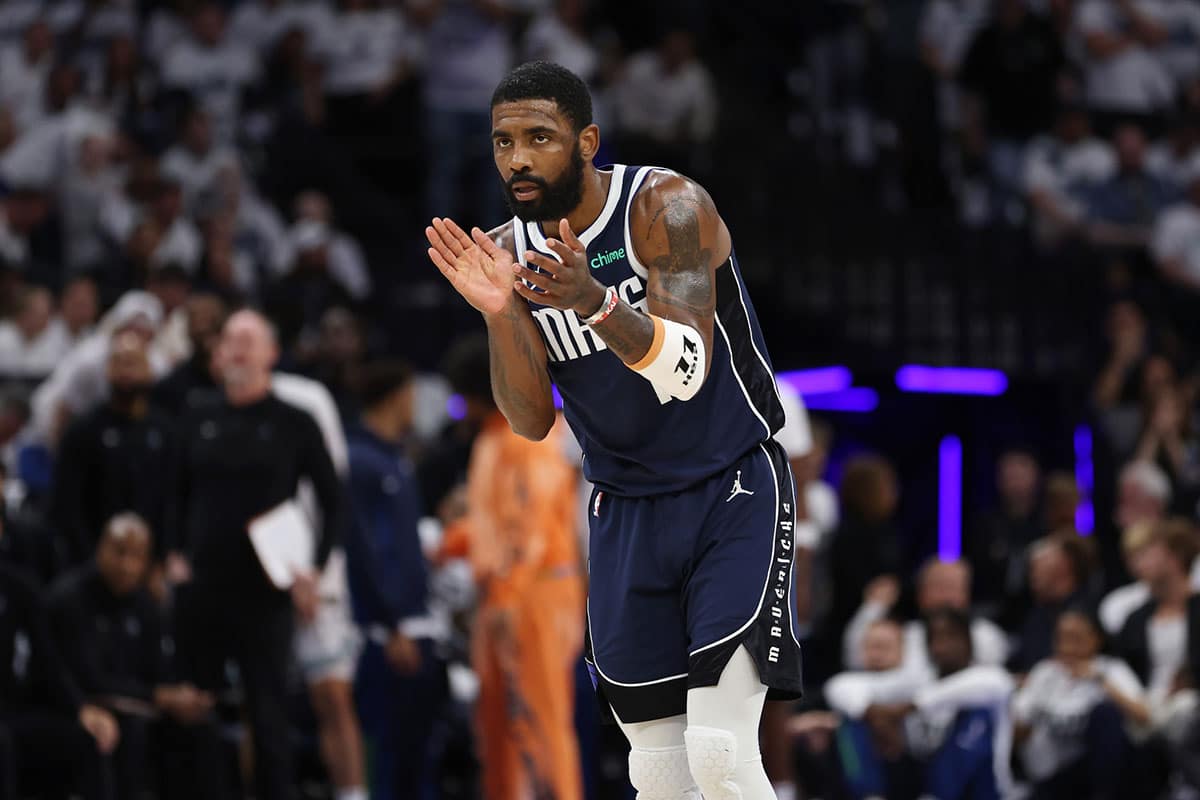 Dallas Mavericks guard Kyrie Irving (11) reacts in the first quarter against the Minnesota Timberwolves during game one of the western conference finals for the 2024 NBA playoffs at Target Center.