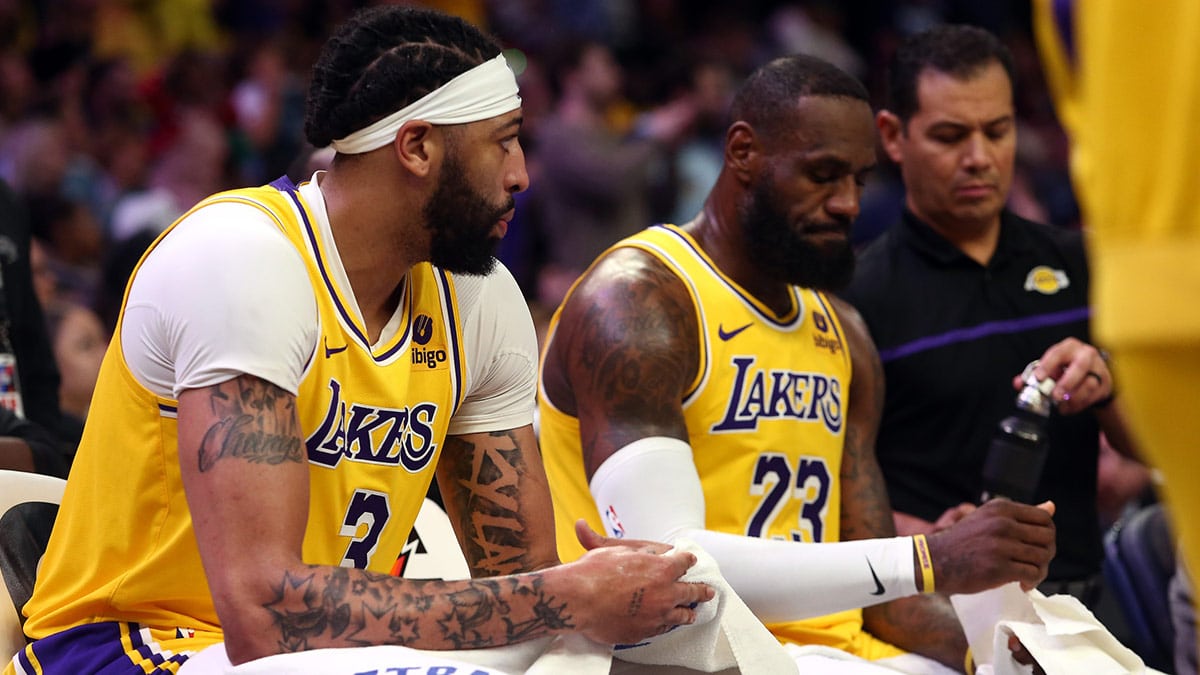 Los Angeles Lakers forward Anthony Davis (3) and forward LeBron James (23) sit on the bench during a time out during the second half against the Memphis Grizzlies at FedExForum.