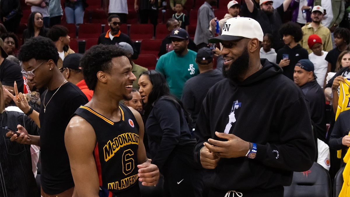 West guard Bronny James (6) with father LeBron James following the McDonald's All American Boy's high school basketball game at Toyota Center.