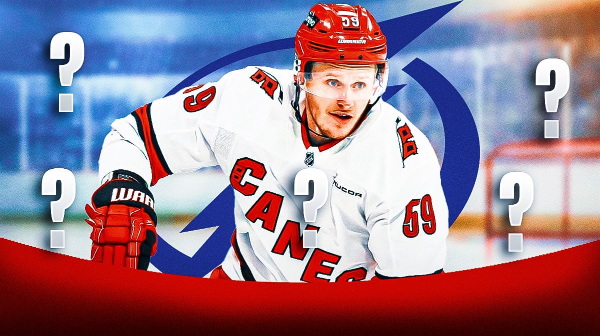 Jake Guentzel in middle of image looking stern, Tampa Bay Lightning logo, 3-5 question marks, hockey rink in background