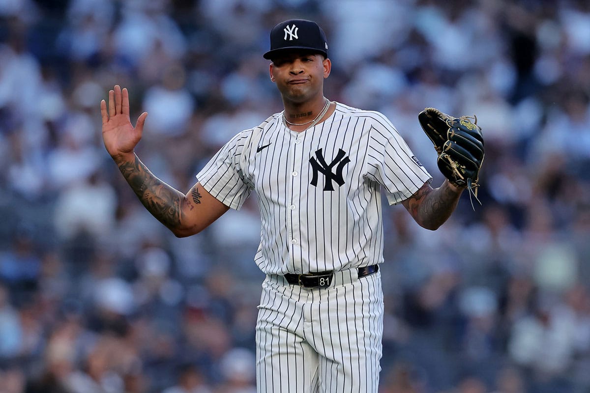 New York Yankees starting pitcher Luis Gil (81) reacts during the second inning against the Los Angeles Dodgers at Yankee Stadium. 